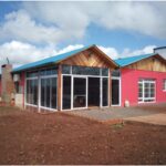 EpC3ADgrafe-Vivienda-rural-construida-en-Colonia-Aurora-de-la-familia-Escher.-Es-una-de-las-pintorescas-mejoradas-por-cuenta-propia-del-beneficiario